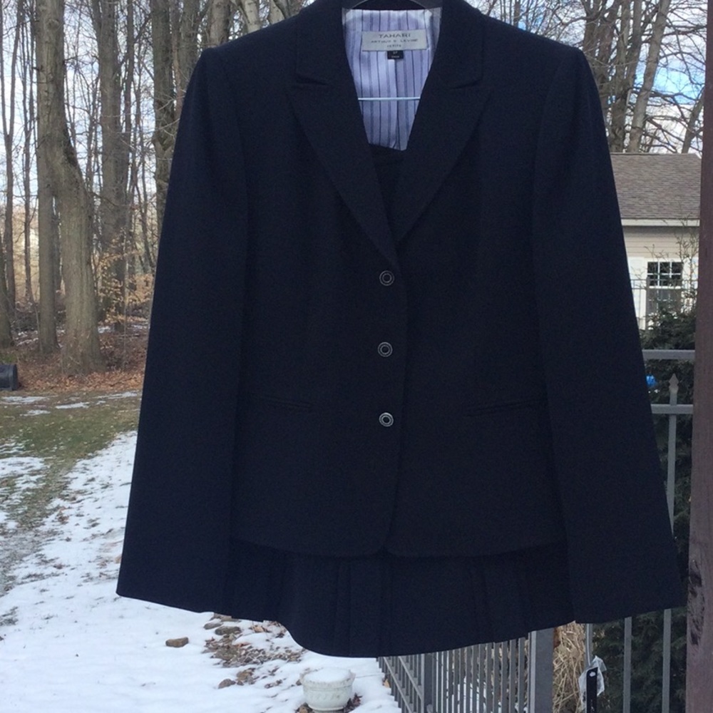 Navy well-tailored suit.  Amazingly crisp details.